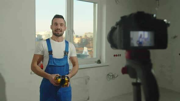 Builder Stands and Talks About Headphones on Camera