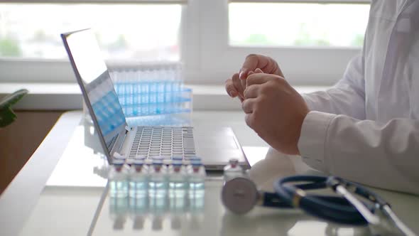 Side Cropped View of a Doctor During Online Videocall with Patient