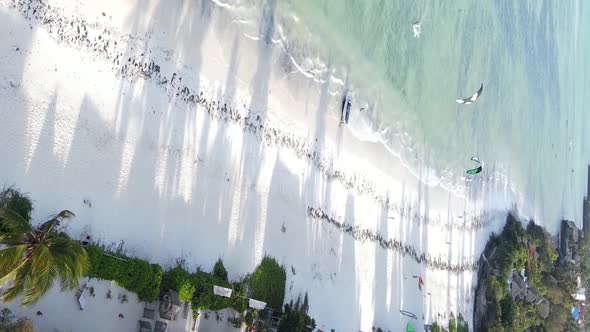 Vertical Video of the Ocean Near the Coast of Zanzibar Tanzania Aerial View