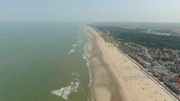 Aerial Panorama of a Sandy Beach Near City Streets and Belgian Houses
