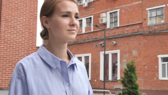 Young Casual Woman Walking on Street