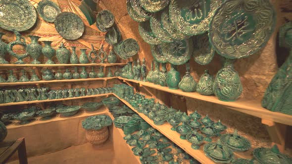 Porcelain And Pots For Sale on The Shelves in The Handmade Artistic Pottery Shop