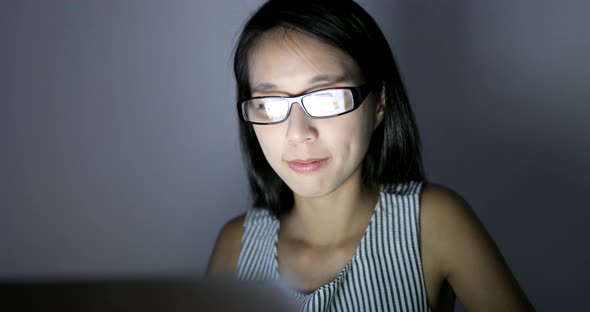 Woman using digital tablet computer at home 