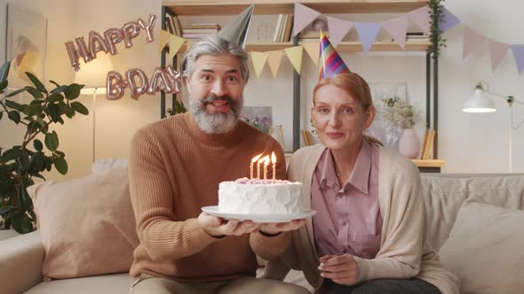 Senior Couple With Birthday Cake