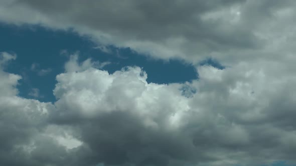 Rain Clouds Spreading Slowly Below The Blue Sky - Timelapse - Time Lapse