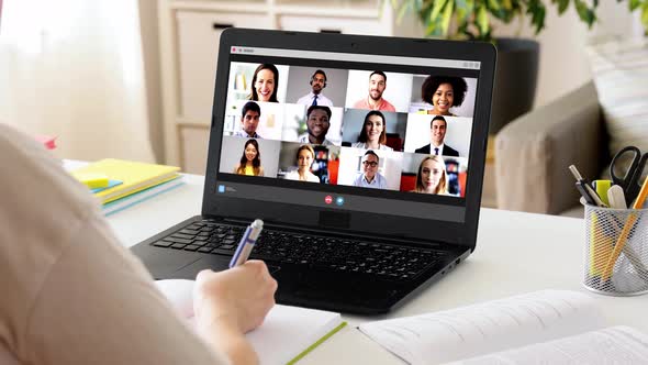 Student Woman with Laptop Has Video Call at Home