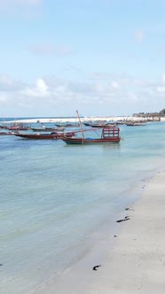 Vertical Video Boats in the Ocean Near the Coast of Zanzibar Tanzania