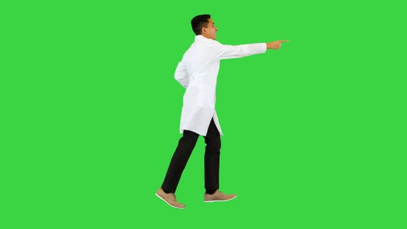 Running Doctor in a Robe Calling for Someone on a Green Screen Chroma Key