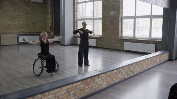 Ball Dancing Couple Warming Up in Dance Hall