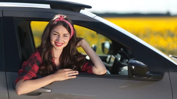 Joyful Brunette Woman on Car Summer Roadtrip