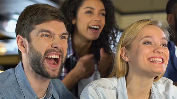 Happy Friends Clapping Hands in Bar, Celebrating Favorite Football Team Victory