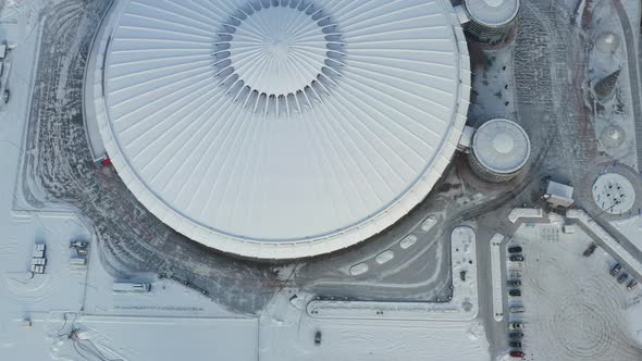 Top view in winter of a modern sports complex with parking in Minsk. Belarus