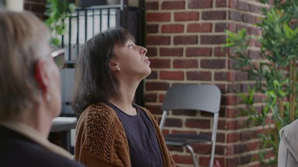 Close Up of Woman Trembling and Having Crisis in Front of People at Aa Group Therapy