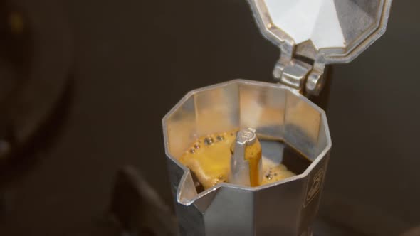 Making Aromatic Black Coffee Using The Traditional  Moka Pot. -closeup shot