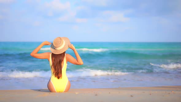 Asian woman enjoy around beautiful beach sea ocean