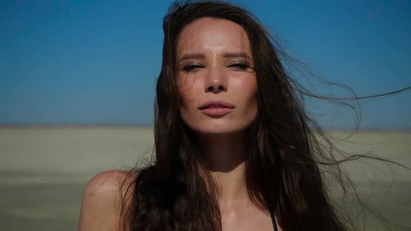 Portrait of a Brunette Girl Looking Into the Camera