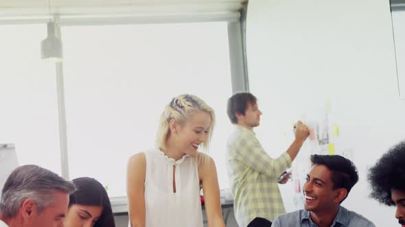 Business executives discussing over mobile phone