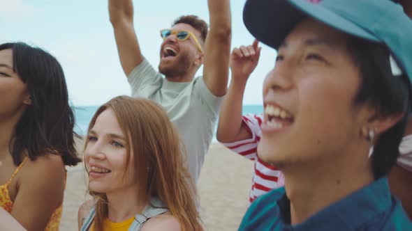 Group of friends having fun on the beach.