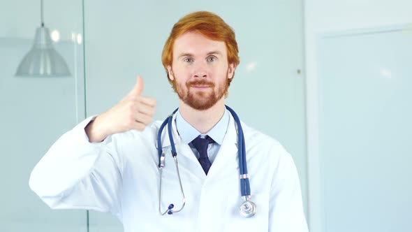 Portrait of Thumbs Up by Doctor in Clinic