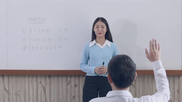 Teacher is teaching in the classroom
