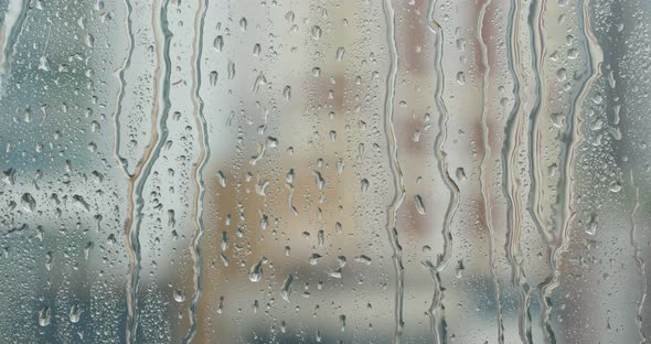 Water droplets on glass, rain outside