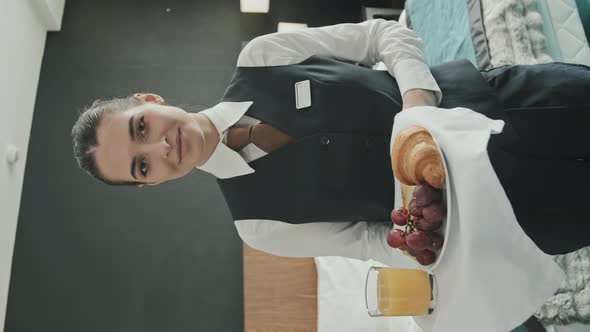 Pretty Waitress with Breakfast on Tray in Hotel Room