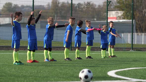 Little Players of Football Club Training Outdoors