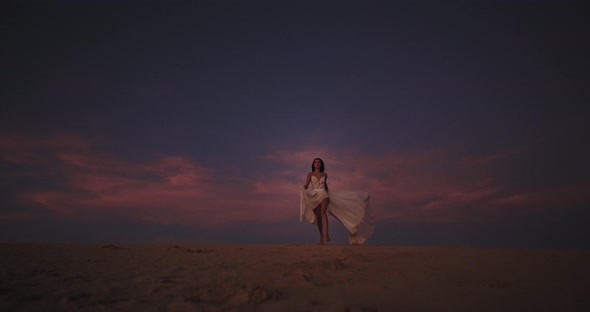 Romantic Lady with a Long White Dress Running