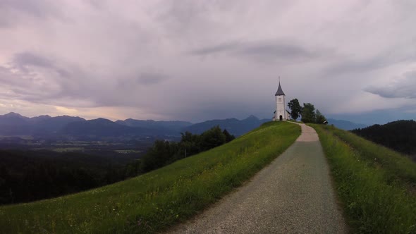 Time Lapse Sunset at Church of St. Primus and Felician, Jamnik, Slovenia	