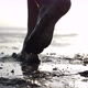 Cinematic Shot of Man with Dirty Feet Walking Barefoot Making Traces Near Pond - VideoHive Item for Sale