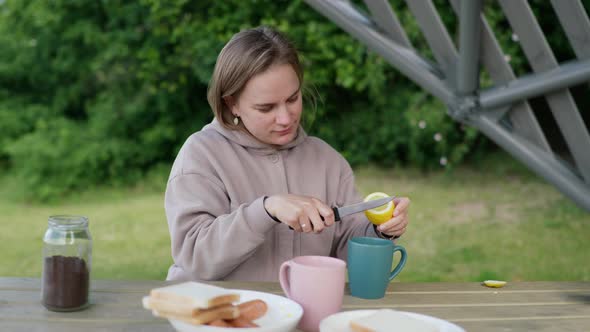 Young Girl Preparing a Picnic in Nature