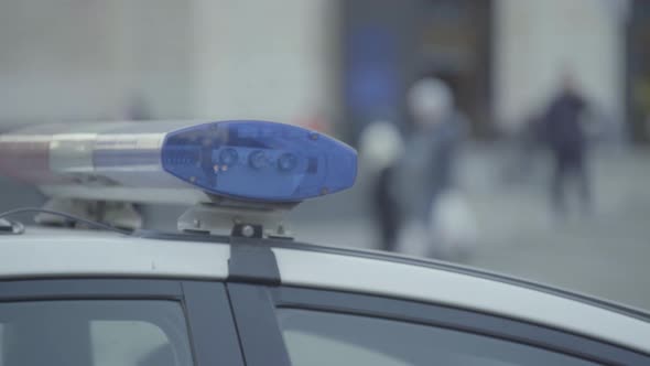 Flashing Flasher on the Roof of a Police Car. Blinker. Close-up.