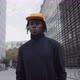 Young African American Man Standing Near the Office Building and Looking at Camera - VideoHive Item for Sale