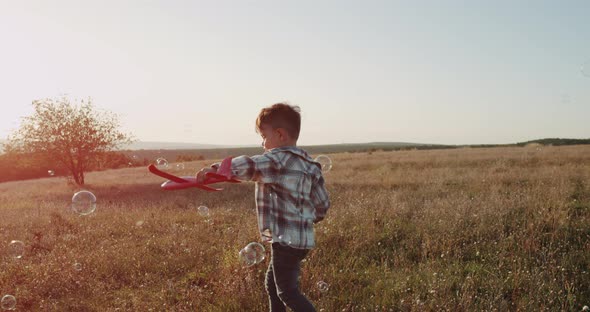 Playing Little Cute Boy with a Red Airplane