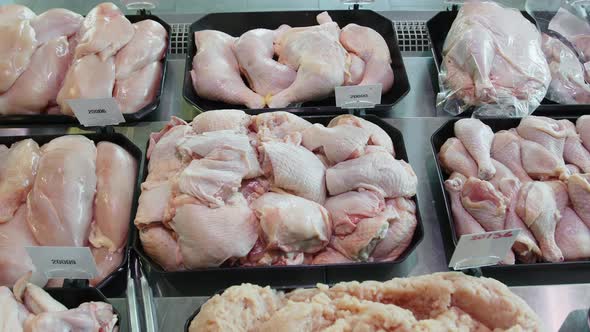 Appetizing Chicken Semi-finished Products Are on Display in Special Containers. Chicken Products for