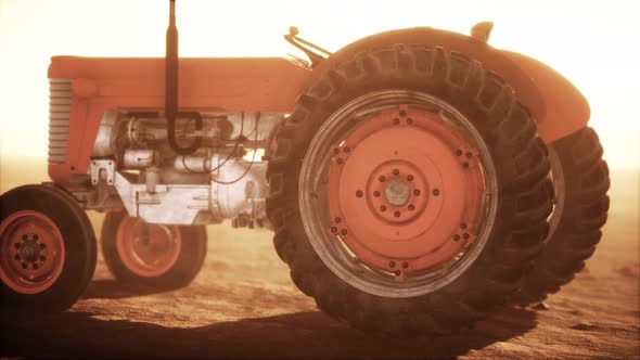 Vintage Retro Tractor on a Farm in Desert