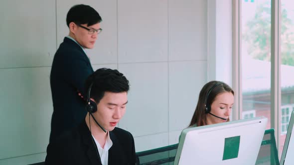 Business People Wearing Headset Working in Office