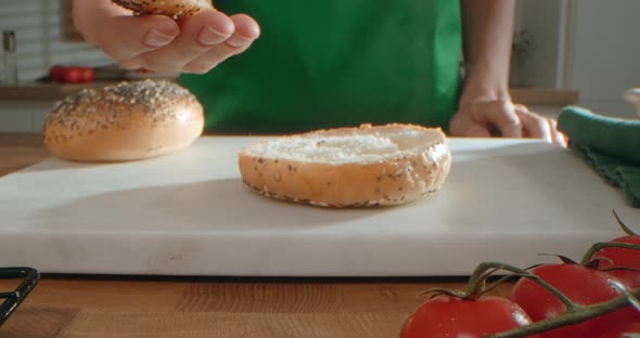 Chef Opens Cutted Hot Burger's Bun with a Steam in It