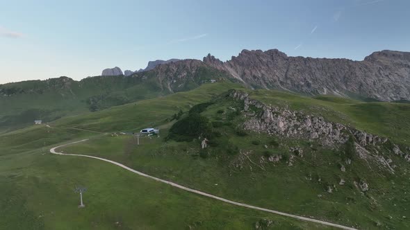 Dolomites cottages under the rugged mountains peaks at sunrise