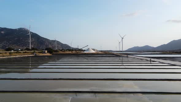 Slow and low aerial flying over salt fields, Vietnam