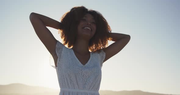 Portrait of African American woman enjoying at beach