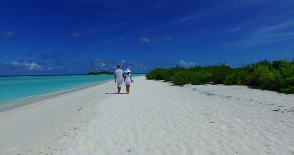 Fun man and woman married on vacation spend quality time on beach on white sand 4K background