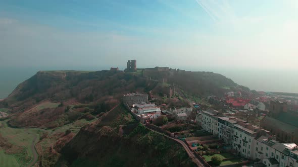 Seaside Town Revealed Scarborough Castle Ruins In North Yorkshire, England. Aerial Tilt-up Shot