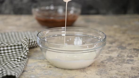 Mixer Whip Heavy Cream In A Bowl. Close-Up.