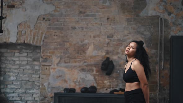 Young African American Woman Takes Break After Workout