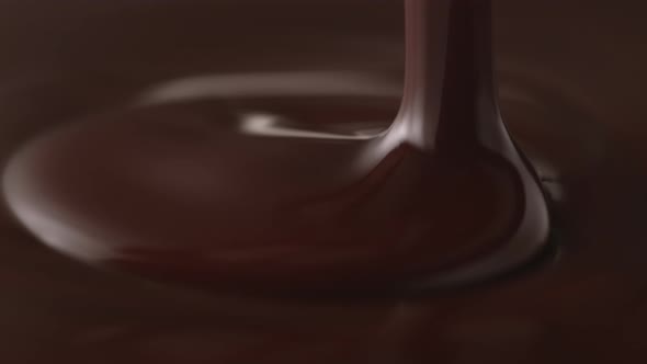Pouring melted chocolate. Slow Motion.