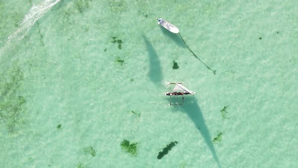 Vertical Video Boats in the Ocean Near the Coast of Zanzibar Tanzania Aerial View