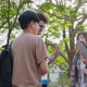Friendly diverse students talking in park together. Education and student. - VideoHive Item for Sale