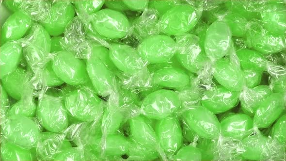 Green Candy In Wrappers Rotating