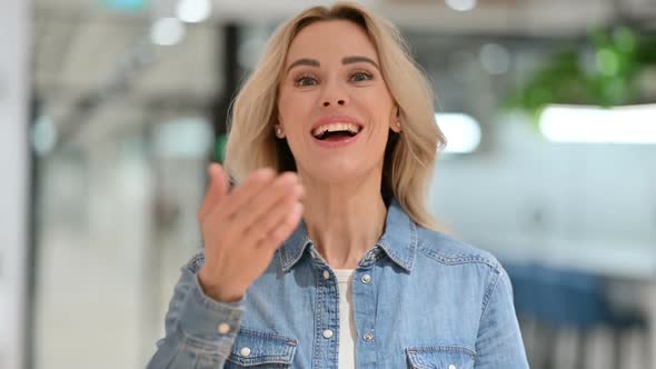 Cheerful Young Woman Talking on Video Call